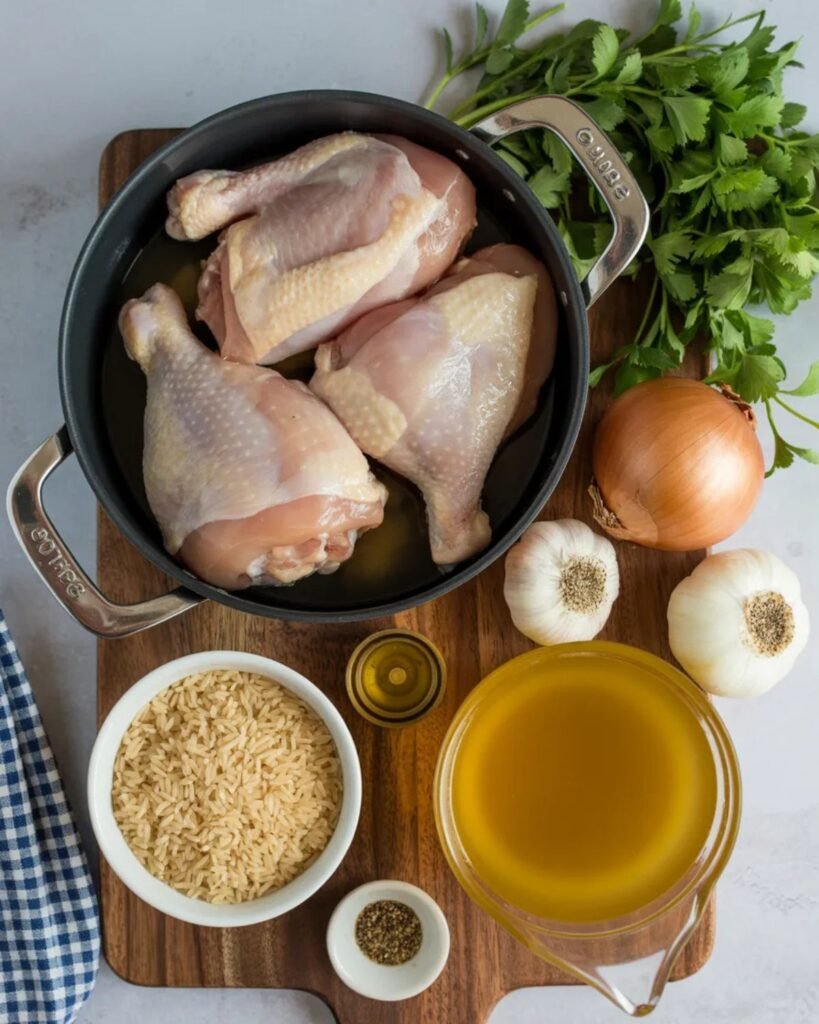 ingredients for one pot chicken and rice recipe including chicken rice garlic and broth