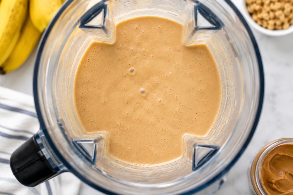 Creamy smoothie blended until smooth inside a blender jar.